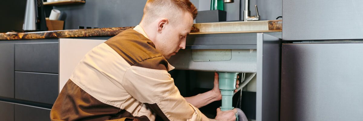 a-man-in-uniform-checking-plumbing-equipment-after-2021-09-24-03-42-54-utc.jpg